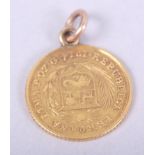 A Peruvian 1/5 de Libra gold coin, dated 1914, with hard mount and suspension loop, 1.8g gross