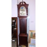 A mahogany long case clock with eight-day striking and chiming movement, arch top dial, 81" high