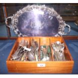 An oval silver plated two-handled tray, engraved initials, and a quantity of plated cutlery and
