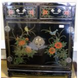 A Chinese floral lacquered side cabinet, fitted two drawers over cupboards, on shaped feet, 24"