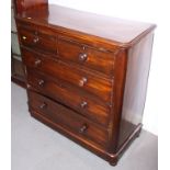 A Victorian mahogany chest of two short and three long graduated drawers with turned handles, on