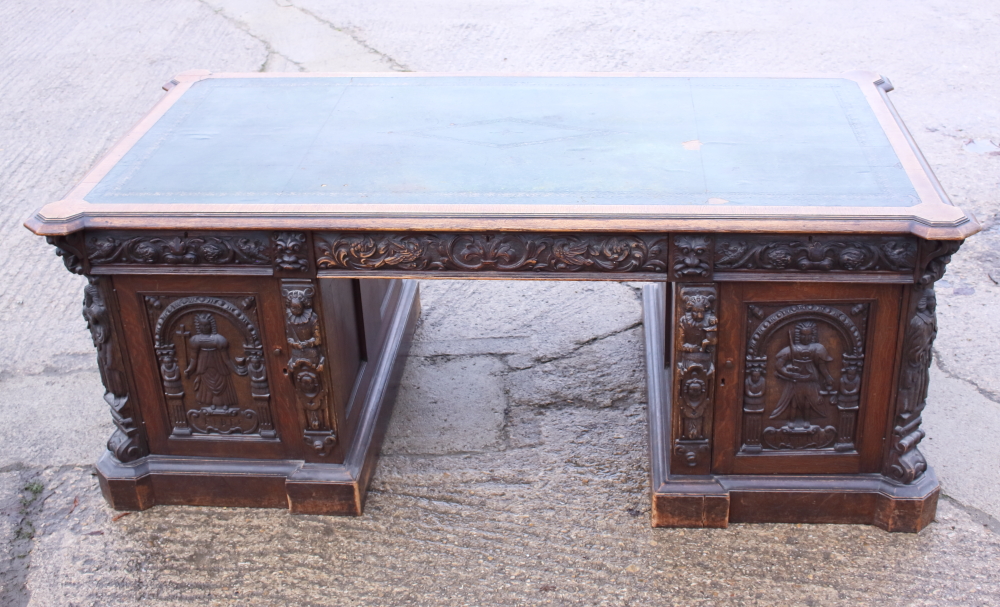 *A partners Victorian oak double pedestal desk with green leather tooled lined top, the pedestals