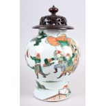An early 18th century Chinese famille verte warrior decorated porcelain oviform jar, 10" high,