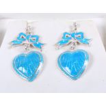 A pair of white metal and enamel heart-shaped drop earrings, stamped sterling