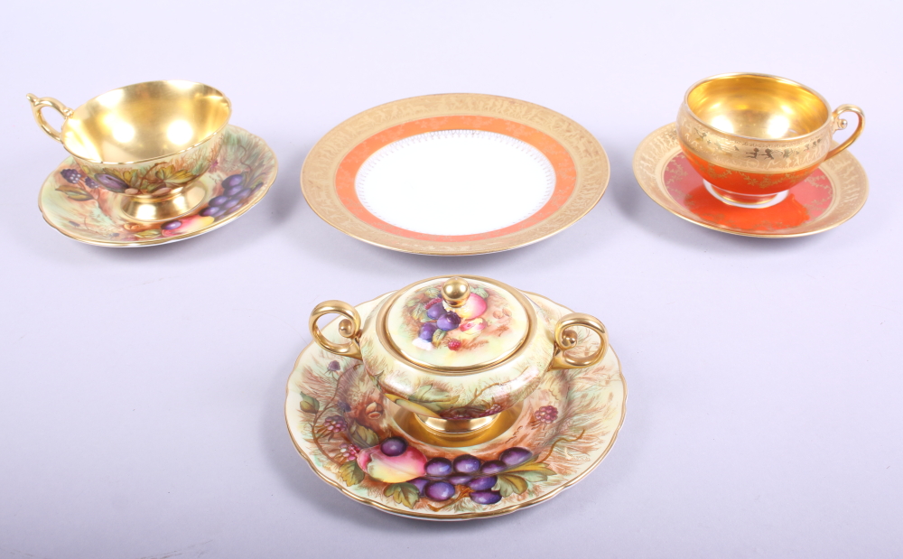 An Aynsley bone china cabinet cup, with saucer and side plate decorated fruit, and a matching two-