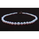 A graduated opalescent bead necklace, 18" long