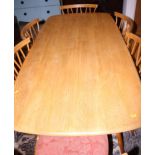 An Ercol elm and beech model 382 dining table, on splay supports, top 60" x 30"