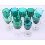 A collection of eleven 19th century green glass wines, various