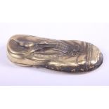 A brass vesta case, in the form of a shoe