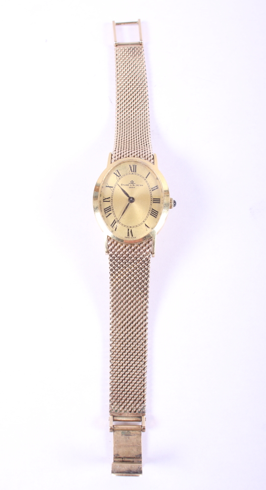 A lady's yellow metal Baume & Mercier bracelet watch with gilt oval dial with Roman numerals and