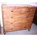 A mahogany chest of two short and three long graduated drawers, on turned supports