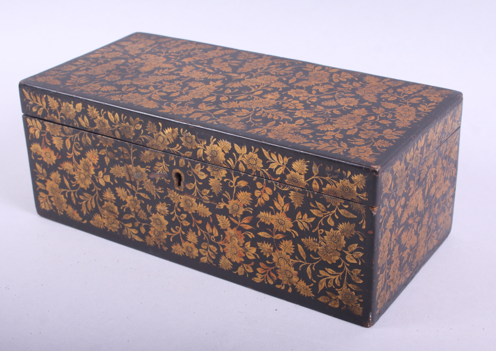 An early 19th century ebonised box decorated gilt flowers, 10 1/2" long