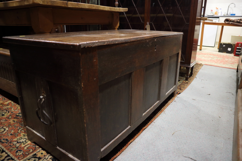 An 18th century oak coffer with candle box and wrought iron carry handles, on stile supports, 46 1/ - Image 2 of 4