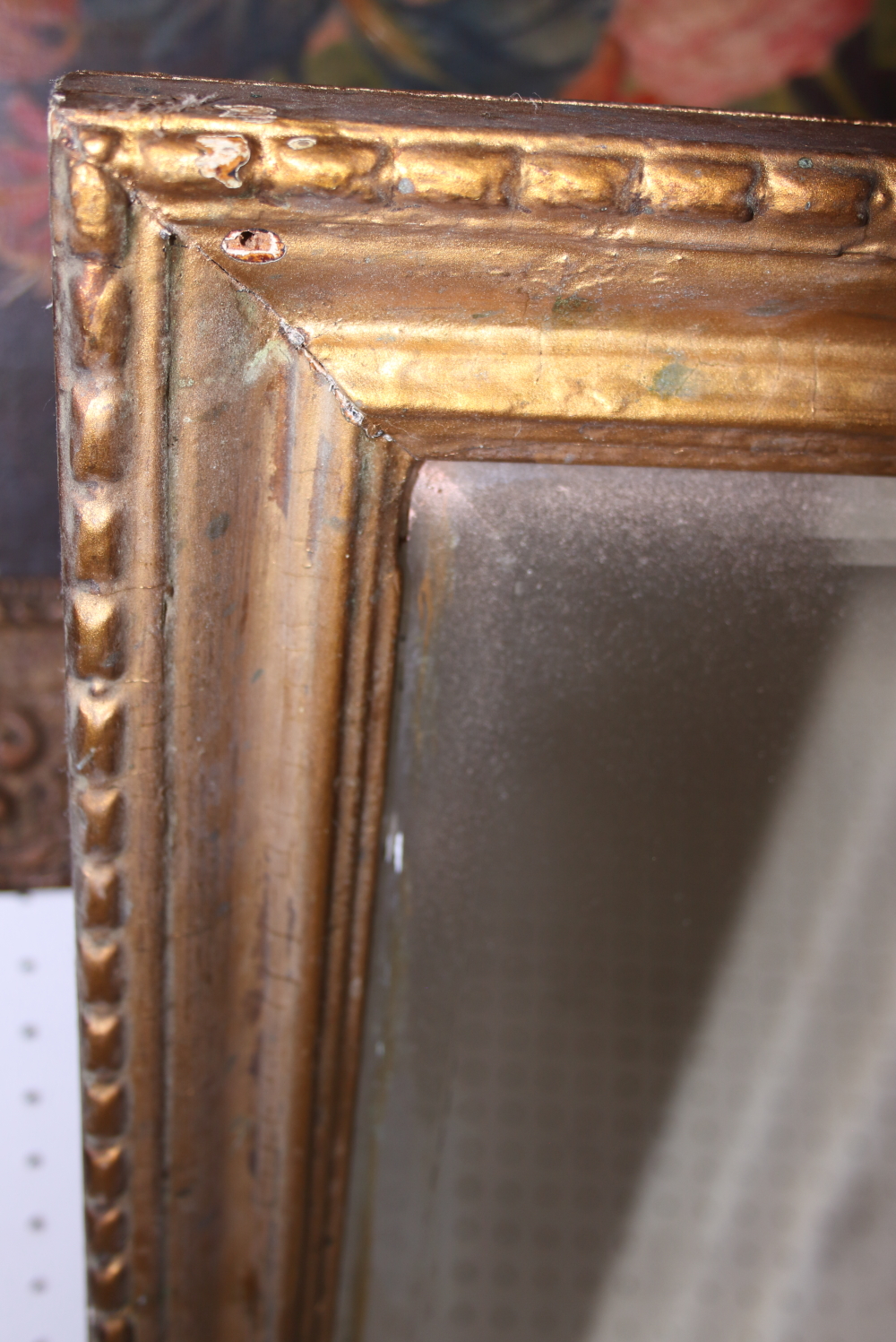 A rectangular gilt frame wall mirror with bevelled glass, 21 1/2" wide - Image 2 of 2