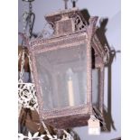 A Victorian metal square tapered hanging lantern, 25" high (two glass panes missing)