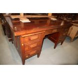 An Oriental hardwood double pedestal desk, fitted seven drawers, on square taper supports, 35" x 57"