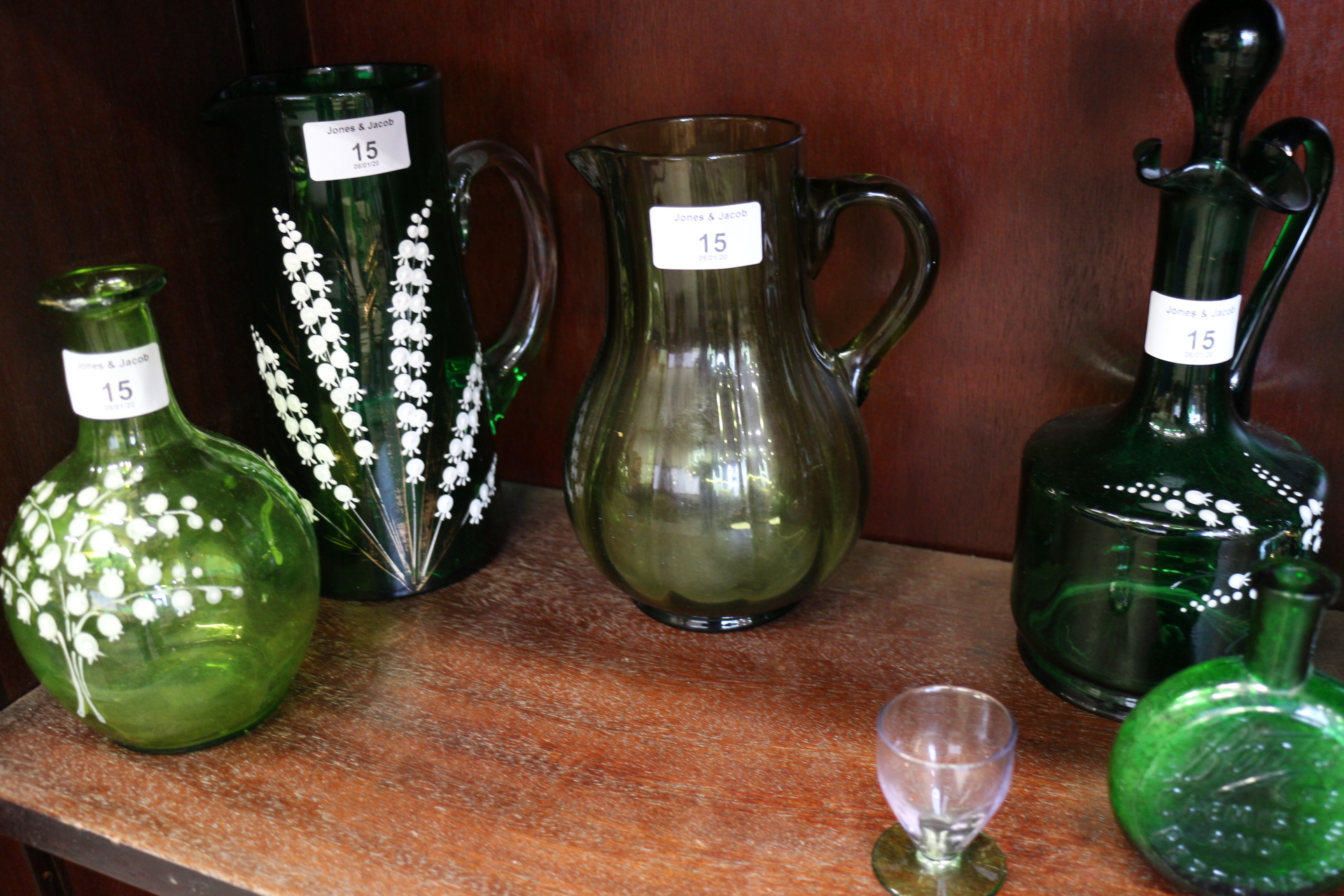 A Mary Gregory type green glass jug with figure decoration, a lily of the valley enamel jug, a - Image 5 of 5