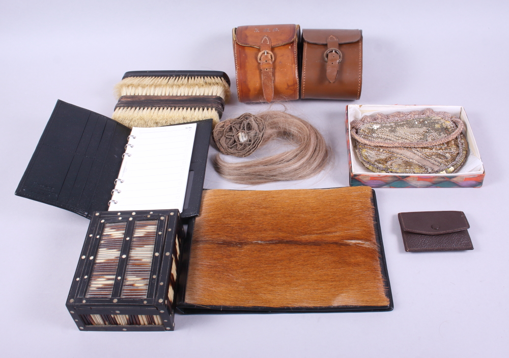 An Anglo-Indian porcupine quill box, three ebony clothes brushes, two leather brush cases, a sequin