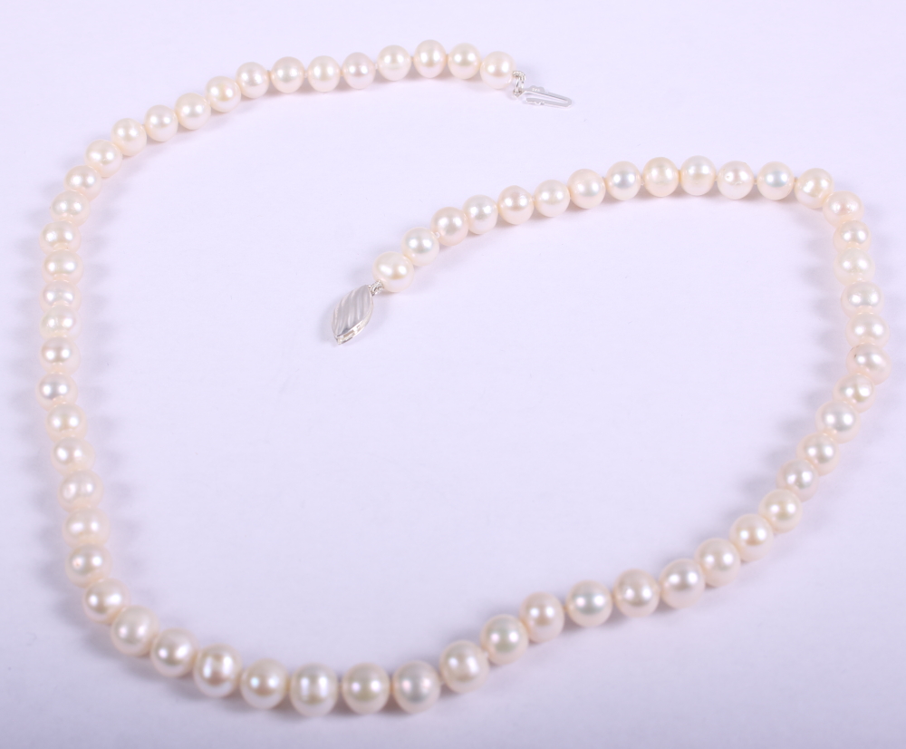 A string of freshwater pearls with white metal clasp, stamped 925, 18" long
