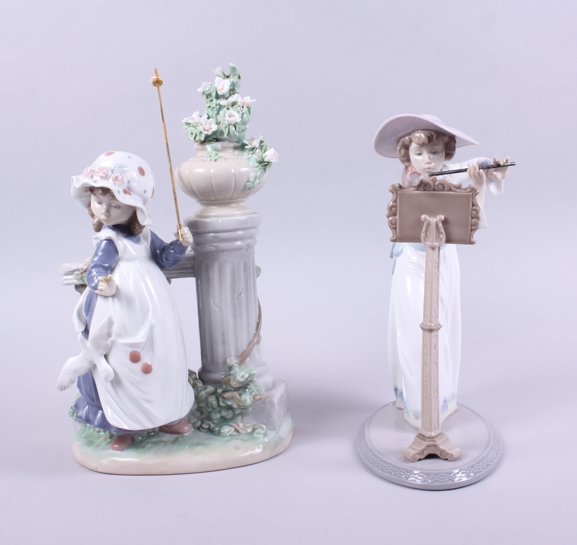 A Lladro figure of a girl playing the flute, 6093, 9 1/2" high, and another Lladro figure of a girl,