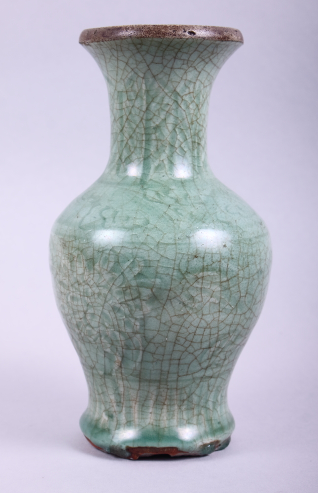 A Chinese Ming celadon glazed vase, 7 3/4" high