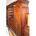 A Victorian figured mahogany wardrobe enclosed three doors, fitted interior with shelves, two