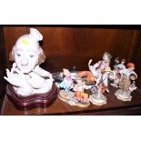 A Lladro model of a clown, on wooden stand, 13" high overall, two Capodimonte figure groups and