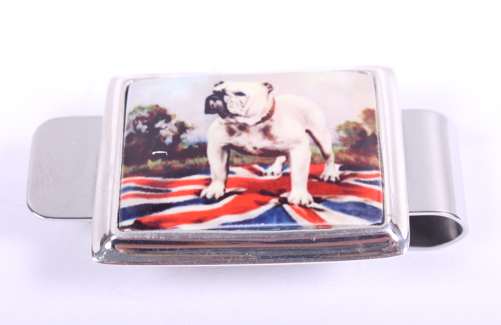 A white metal money clip, decorated with a bulldog, stamped sterling