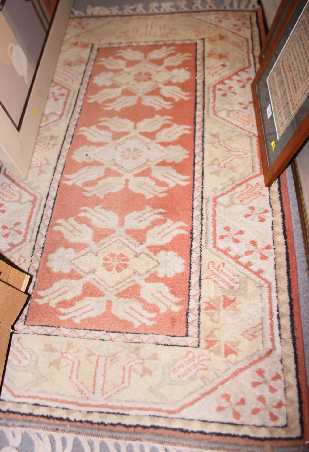 A Persian Kazak tribal rug with three hooked gulls on a rust ground and multi bordered in shades