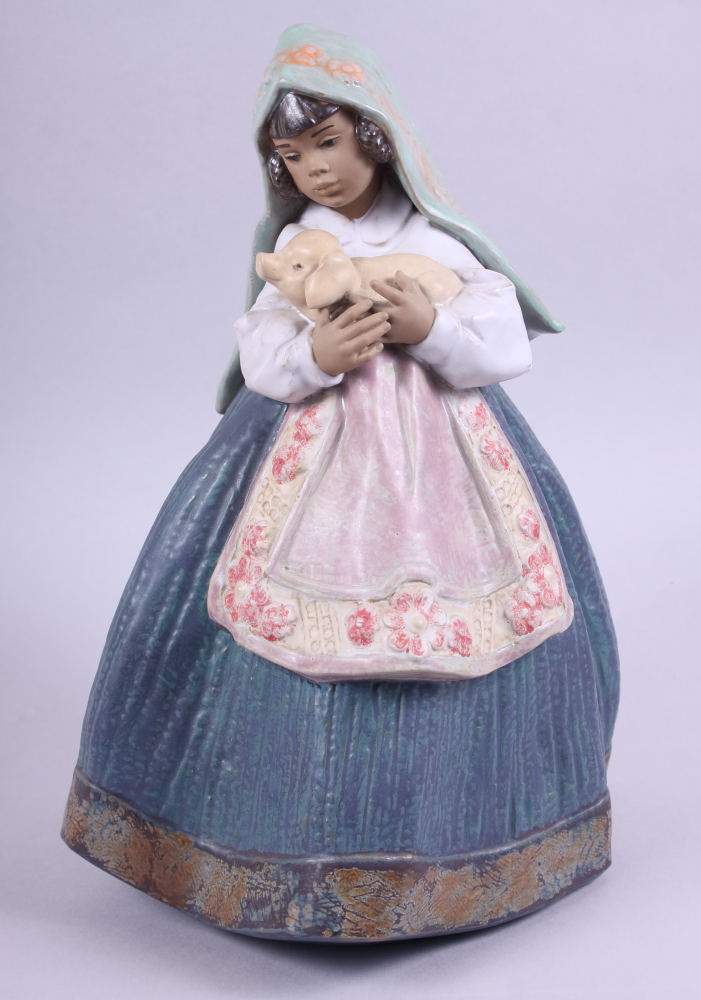 A Lladro gres figure of a girl holding a piglet, "Country Joy" 2356, 11 3/4" high