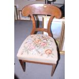 A 1930s Continental mahogany dining chair with floral embroidered seat, on square taper supports