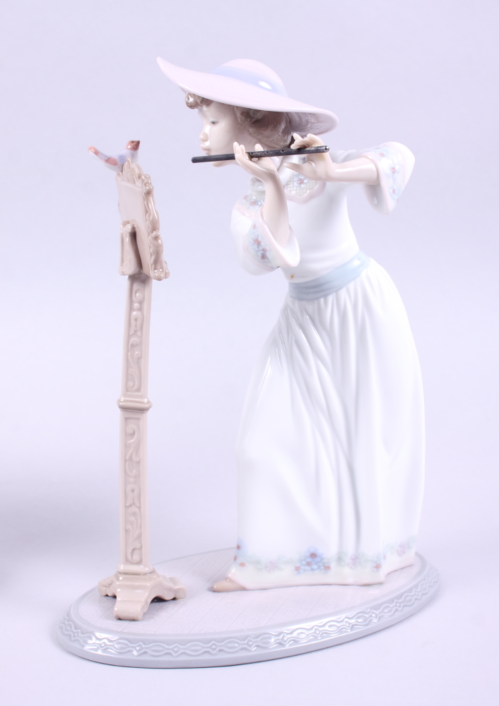 A Lladro figure of a girl playing the flute, 6093, 9 1/2" high, and another Lladro figure of a girl, - Image 2 of 4