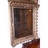 An ornate gilt framed rectangular wall mirror, 26" x 22"