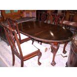 A late 19th century mahogany oval dining table with wind-out mechanism and one leaf, on cabriole