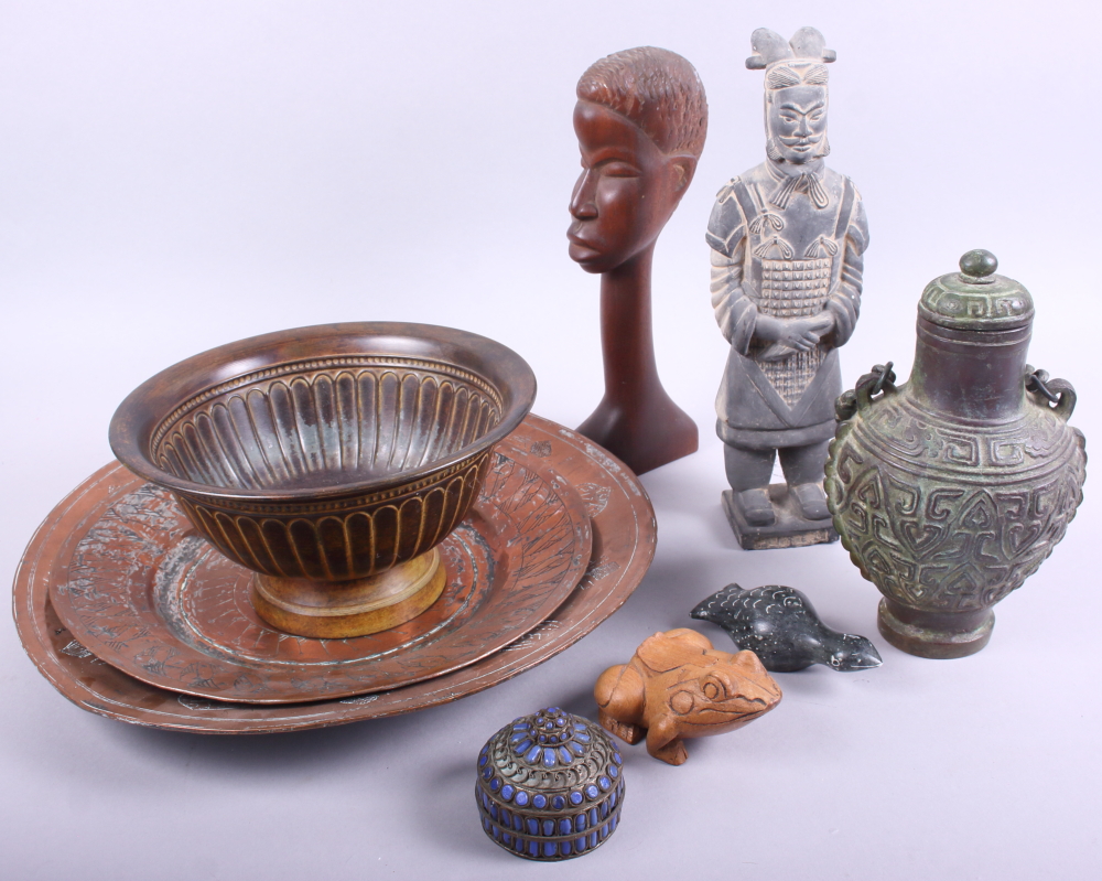 A Tang style ceramic figure of a man, two Middle Eastern copper dishes, a bronze bottle and other