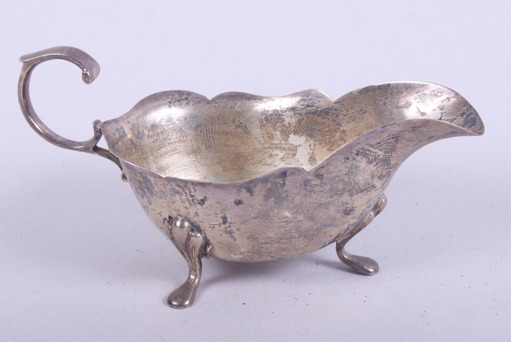 A silver sauce boat with waved border, 3.0oz troy approx