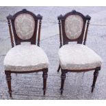 A pair of late Victorian carved walnut loopback side chairs