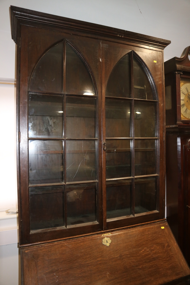 A late Georgian oak bureau bookcase, the upper section enclosed two arch top glazed doors over - Image 2 of 3