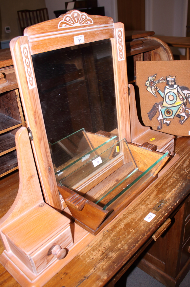 An Art Deco oak and glass stationery trough, a pine framed dressing table mirror and a Collarford