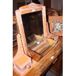 An Art Deco oak and glass stationery trough, a pine framed dressing table mirror and a Collarford