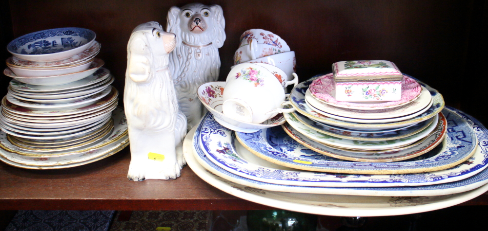 A pair of Staffordshire dogs, and an assortment of willow pattern platters, mixed plates and other