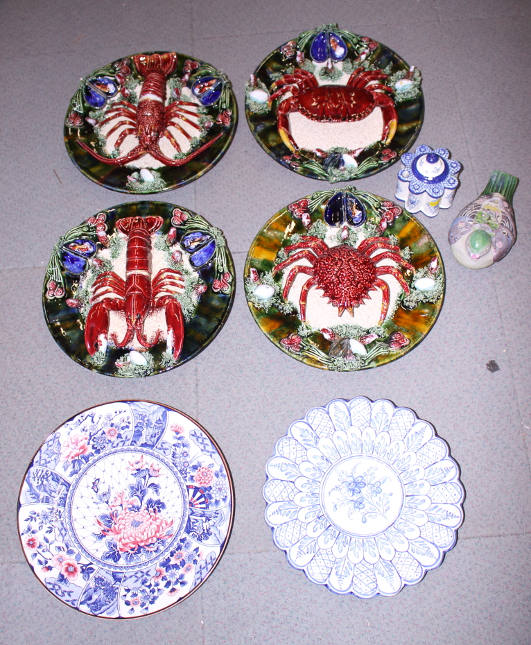 Four Palissy style pottery dishes, decorated crustaceans, a Delft charger, a similar inkwell, a