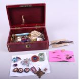 A red morocco leather jewellery box, containing a 9ct gold floral spray brooch, a number of