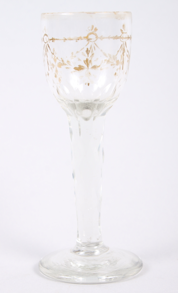 A mid 18th century cordial glass with gilt decorated bowl and faceted stem, 5" high (gilding