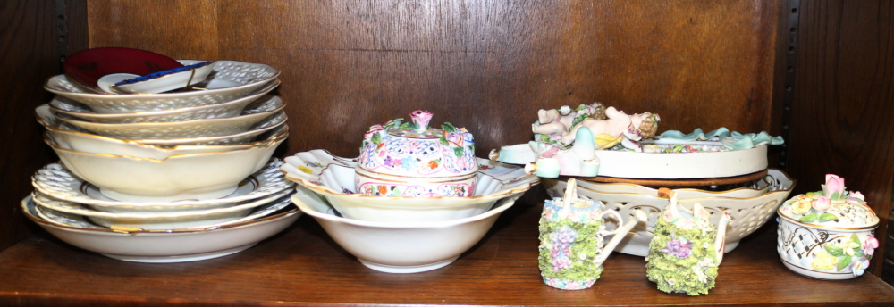 A quantity of mostly Continental china including a mirror, decorated cherubs, a Dresden dish,