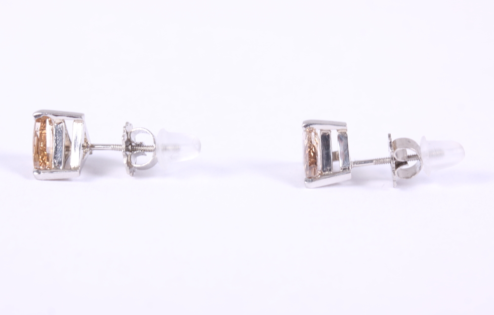 A pair of triangular solitaire diamond and white metal ear studs, stamped Plat 950 - Image 2 of 2