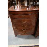 An Oriental hardwood and brass inlaid bowfront chest of four long drawers and lift up lid, on