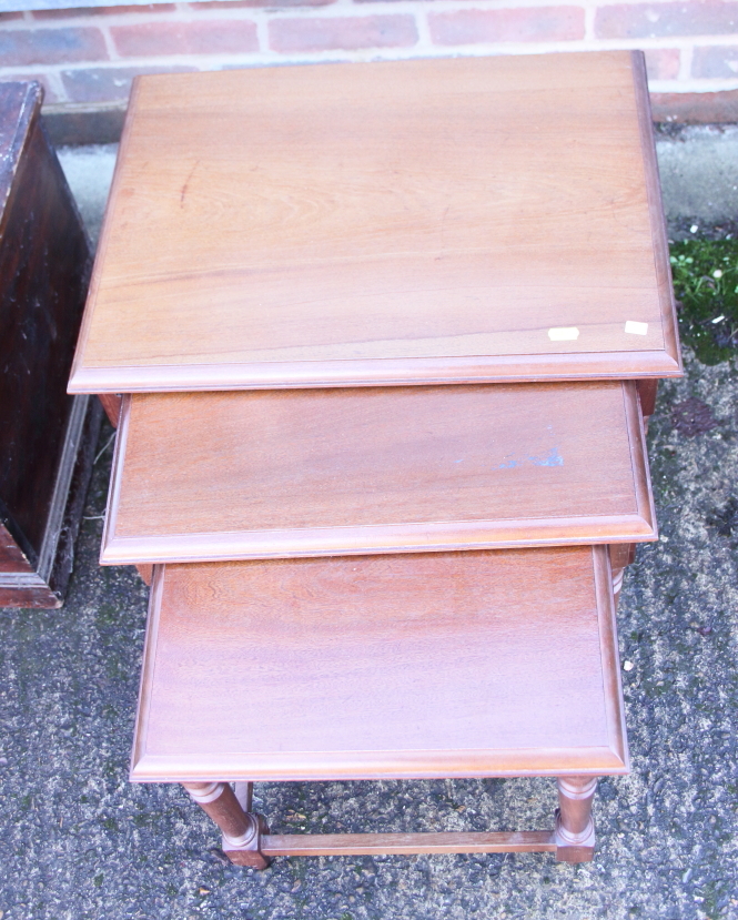 A nest of three walnut occasional tables, on turned and stretchered supports, largest table, 21" - Image 2 of 5