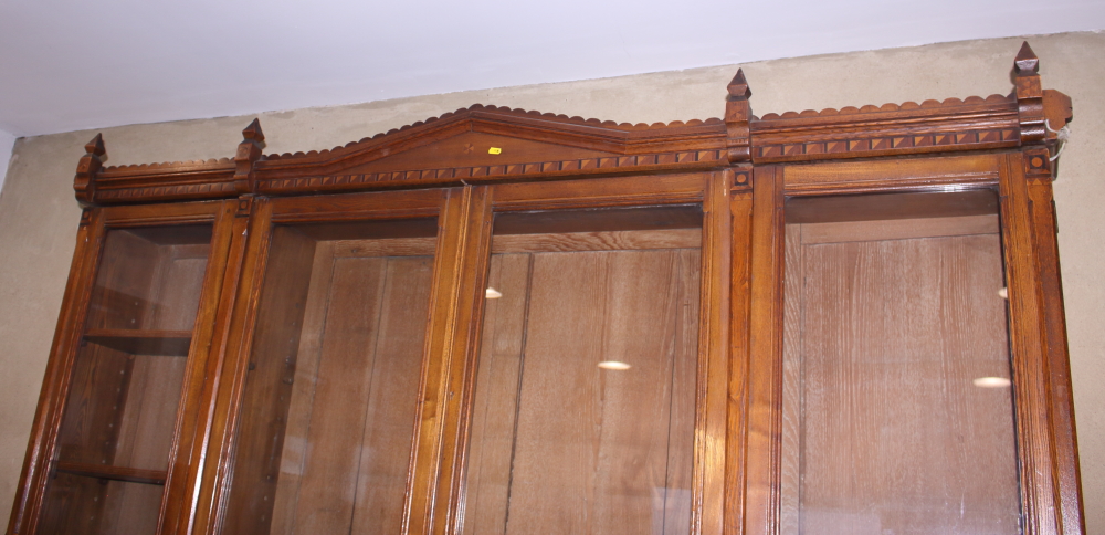 A late Victorian Aesthetic Movement ash, box and ebony inlaid bookcase enclosed by four glazed doors - Image 4 of 4