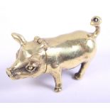 A brass vesta case, formed as a pig